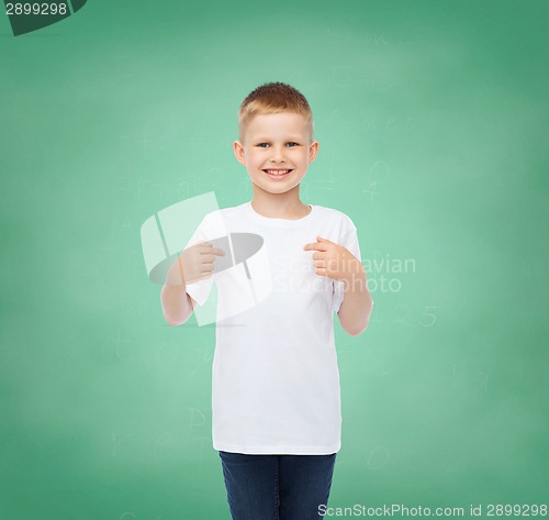 Image of little boy in white t-shirt pointing his finger