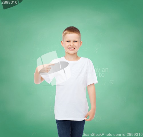 Image of little boy in white t-shirt pointing his finger