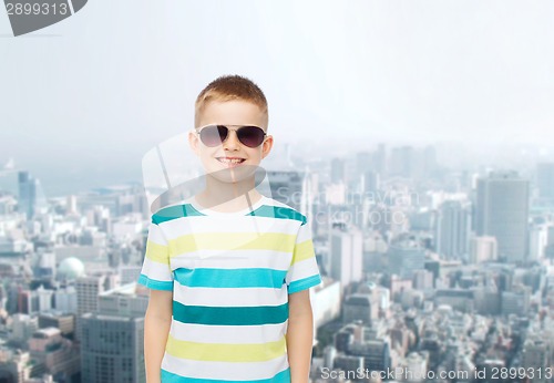 Image of smiling little boy over green background