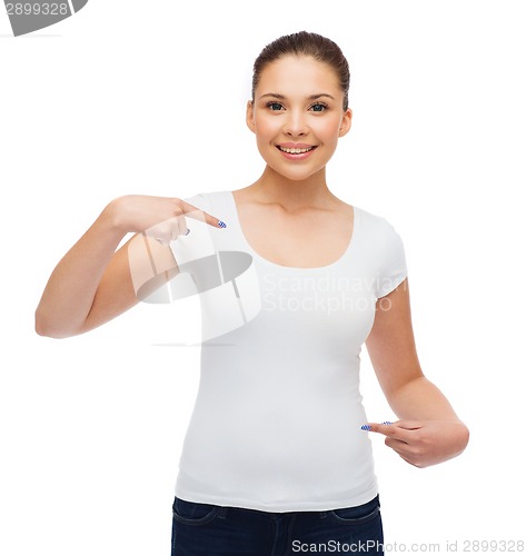 Image of smiling young woman in blank white t-shirt