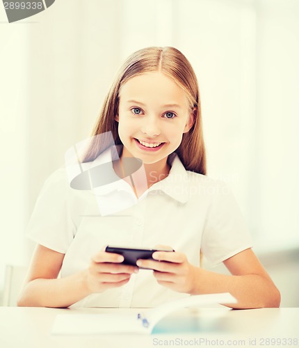 Image of girl with smartphone at school