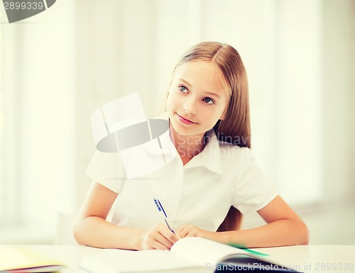 Image of student girl studying at school