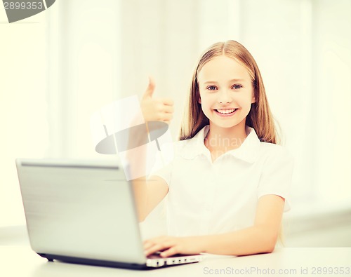 Image of girl with laptop pc at school