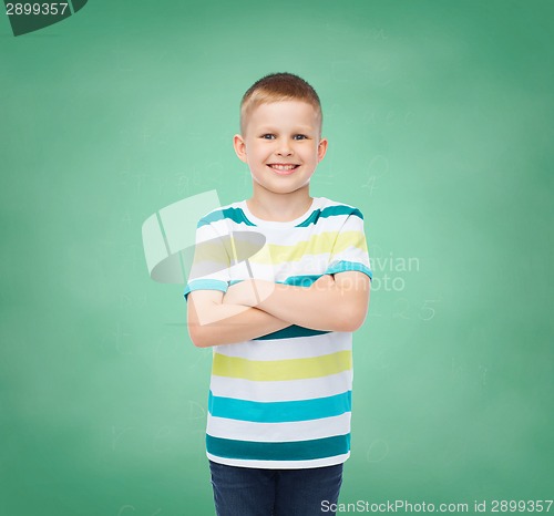 Image of little boy in casual clothes with arms crossed