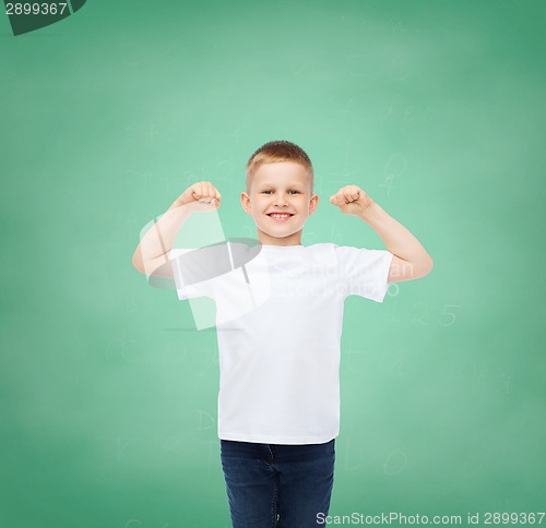 Image of little boy in white t-shirt with raised hands