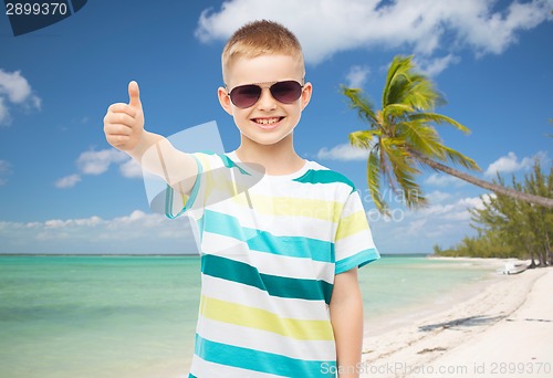 Image of smiling little boy over green background