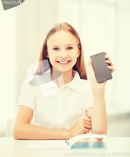 Image of girl with smartphone at school