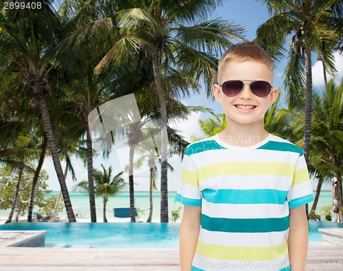 Image of smiling little boy over green background