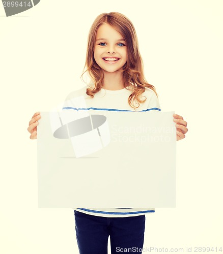 Image of smiling little child holding blank white paper