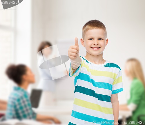 Image of little boy in casual clothes with arms crossed