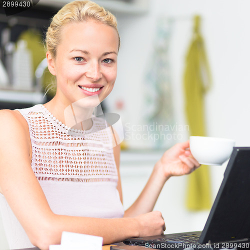 Image of Business woman working from home.