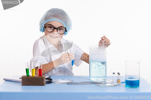 Image of Cheerful girl chemist puts experience