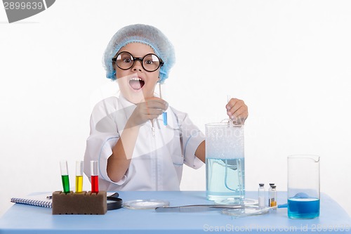 Image of Cheerful girl chemist