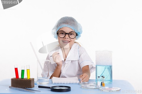 Image of Chemist making notes in notepad