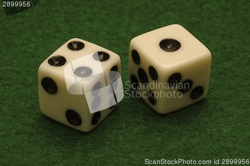 Image of Dice on a green felt gambling table