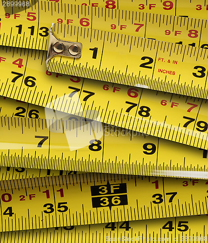 Image of Close up of metal yellow measuring tapes 