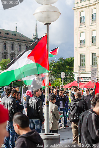 Image of Palestinian flags, slogans and posters