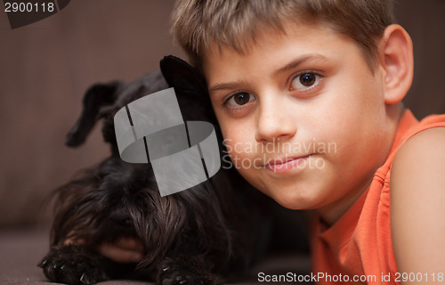 Image of Little boy with his dog