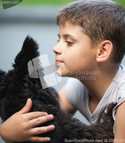 Image of Little boy and his dog