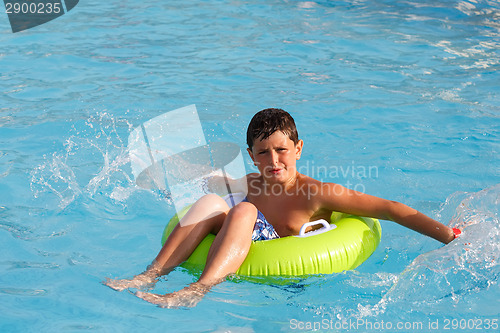 Image of Boys swimsuit floating in the pool float 