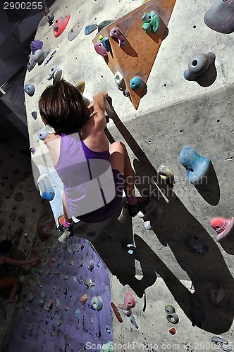 Image of Child exercising at bouldering gym 