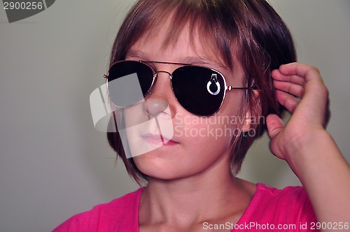 Image of child wearing sunglasses