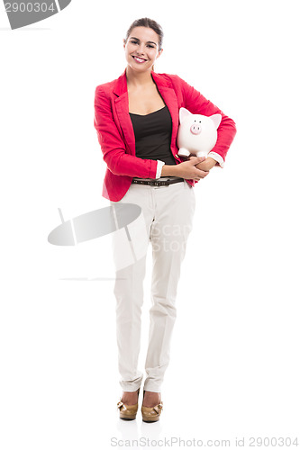 Image of Business woman with a piggy bank