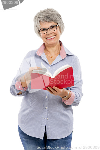 Image of Elderly woman reading a book