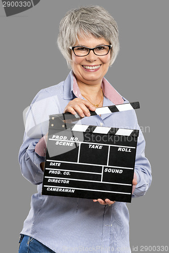 Image of Elderly woman holding a clapboard