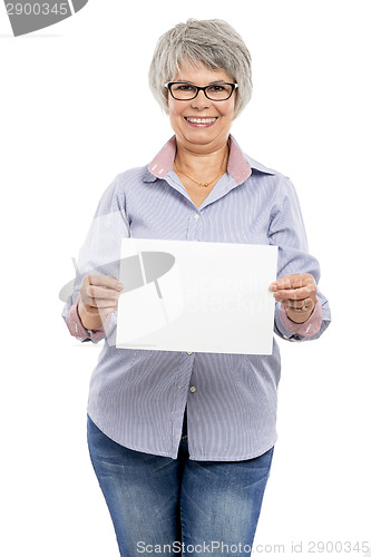 Image of Elderly woman holding a blank paper card