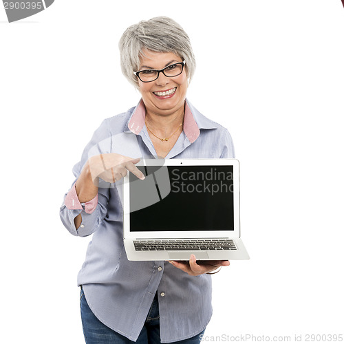 Image of Elderly woman showing something on a laptop