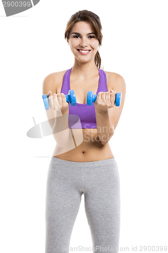 Image of Athletic woman lifting weights