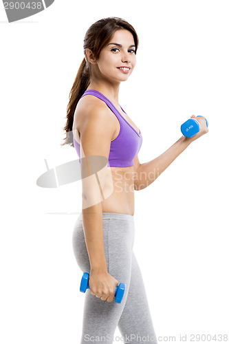 Image of Athletic woman lifting weights