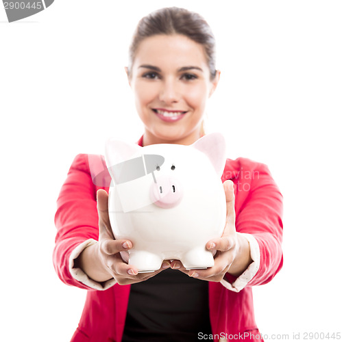 Image of Business woman with a piggy bank