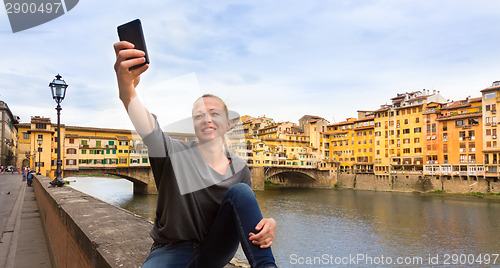 Image of Lady taking selfie in Florence.