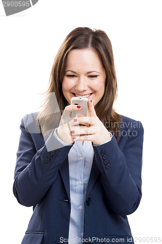 Image of Business woman with a cellphone texting