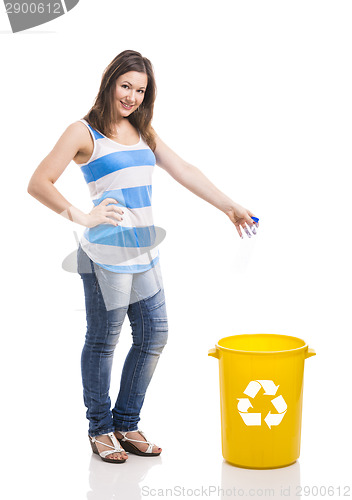 Image of Beautiful young woman recycling