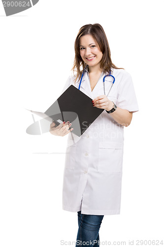 Image of Beautiful young veterinary holding a folder, isolated over white