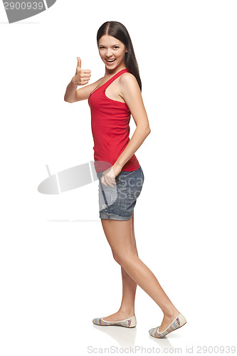 Image of Smiling emotional girl giving you thumb up