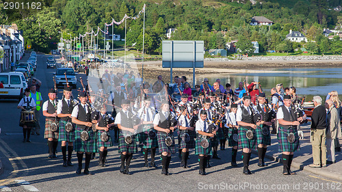 Image of ULLAPOOL, SCOTLAND - JULY 17: Bagpipes' parade at local Highland