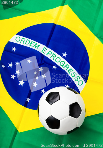 Image of Fabric flag of Brazil and soccer ball