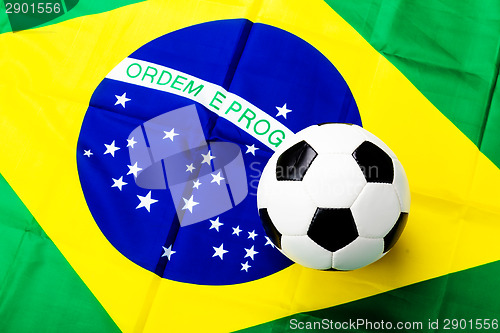 Image of Brazilian flag with soccer ball