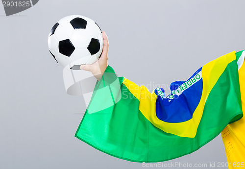 Image of Hand scratch with football with brazil flag