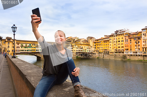 Image of Lady taking selfie in Florence.