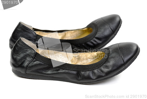 Image of A pair of black leather shoes ballet flats