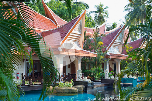 Image of tropical resort hotel swimming pool.