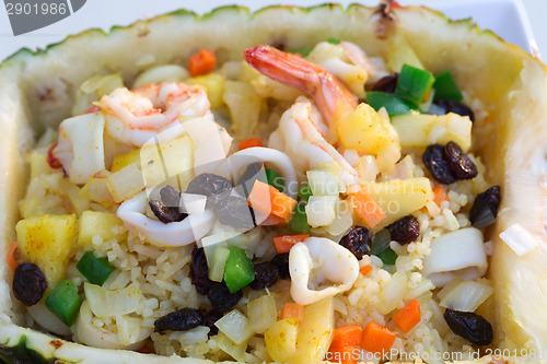 Image of rice with seafood in a pineapple