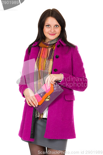 Image of girl in a coat and a clutch bag