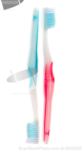 Image of A blue and a red toothbrush isolated on white background.