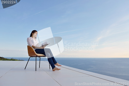 Image of relaxed young womant at home